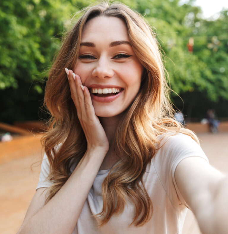 young lady smiling with blonde hair