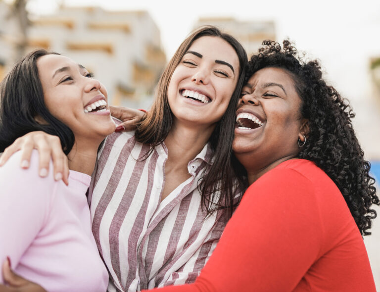 three young female ladies enjoying life with their beautiful smiles